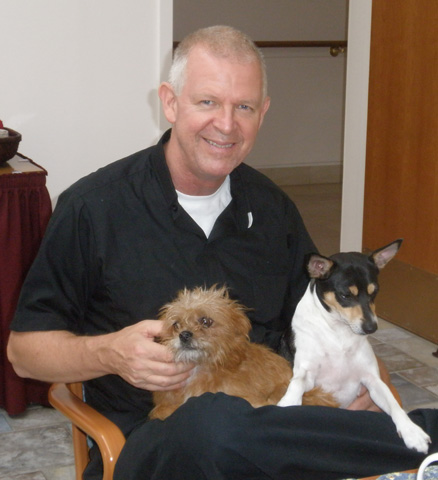 Fr. Francis Shannon, 56, with some of his dogs (Lee Guirreri RSM)