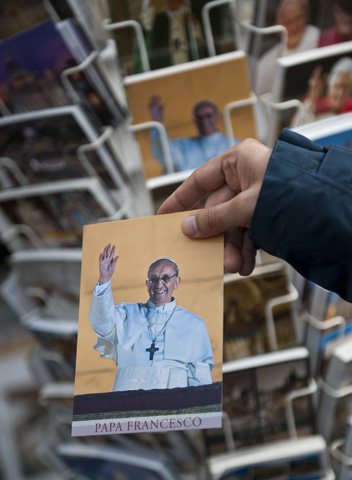 Postcards featuring an image of Pope Francis from the night of his election for sale March 15 at a shop in Rome. (CNS/Bishops' Conference of England and Wales/Marcin Mazur) 