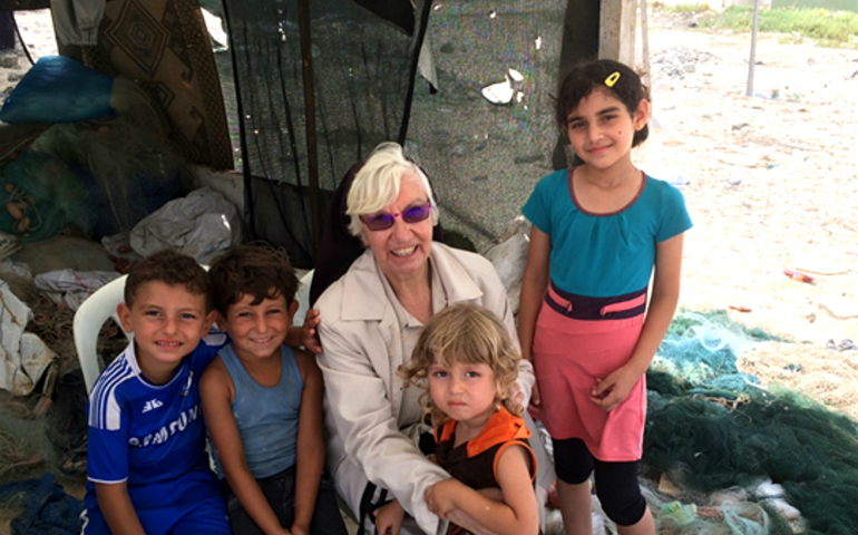 Sr. Bridget Tighe with the children of fisherment who live on the border with Egypt. (Provided photo)