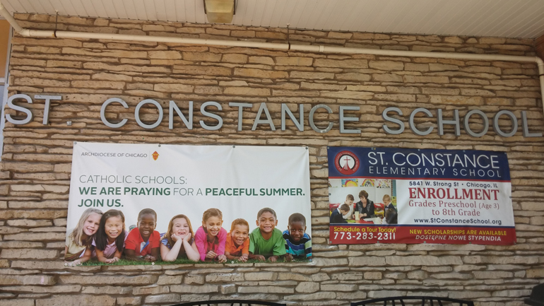 A banner seen outside of St. Constance School in Chicago to promote a peaceful summer after recent violence throughout the nation. (Chicago archdiocese)