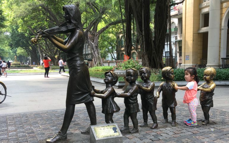 Teagan (Tian Xin Yue) plays at a sculpture on Shamian Island in Guangzhou, China, while her parents, the Worleys of Tennessee, were finalizing some of the last adoption paperwork earlier this year. (Courtesy of the Worley family)