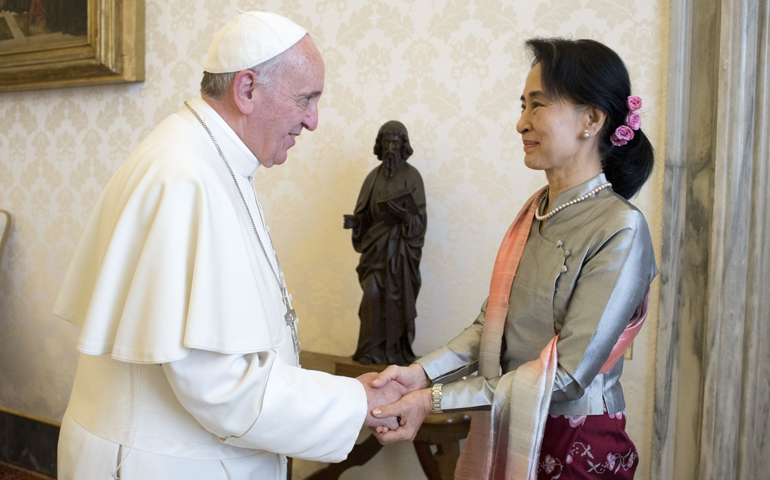 Pope Francis shakes hands with Myanmar pro-democracy leader Aung San Suu Kyi during a meeting Monday at the Vatican. (CNS/Reuters/L'Osservatore Romano)