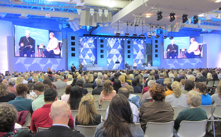 Bishop Kevin Vann of Orange County and Rick Warren of Saddleback Church welcome more than 3,000 attendees to the Gathering on Mental Health and the Church on Friday at Saddleback Church. (Megan Sweas)