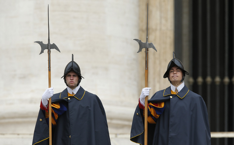 Swiss Guards stand at attention as Pope Francis leads his Sept. 24 general audience in St. Peter's Square at the Vatican. (CNS/Paul Haring) 