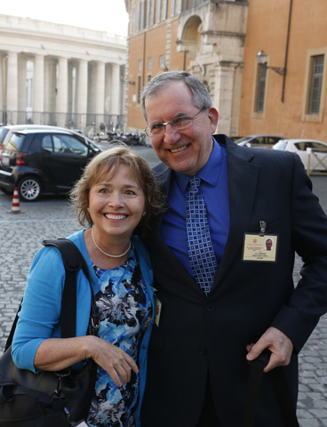 Alice and Jeff Heinzen of Menomonie, Wis., pose for a photo as they arrive for the morning session of the extraordinary Synod of Bishops on the family Tuesday at the Vatican. (CNS/Paul Haring)