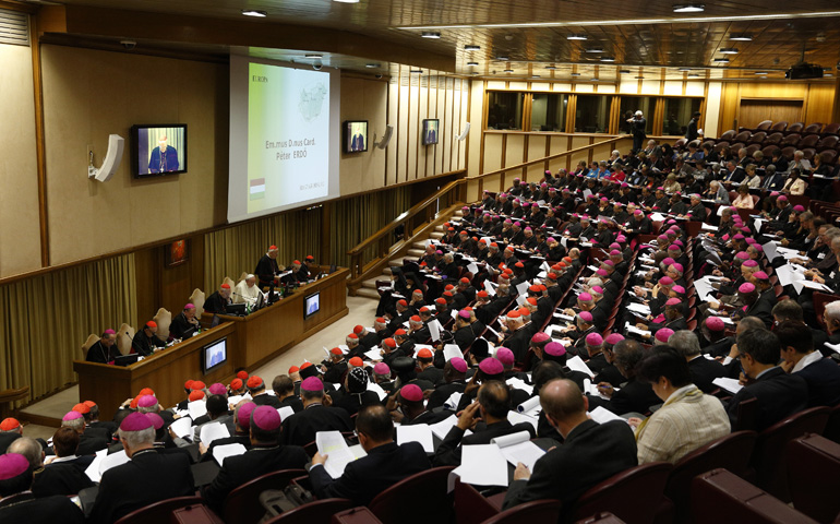 Pope Francis and prelates listen as Cardinal Peter Erdo of Esztergom-Budapest, Hungary, addresses the morning session of the extraordinary Synod of Bishops on the family Monday at the Vatican. (CNS/Paul Haring)