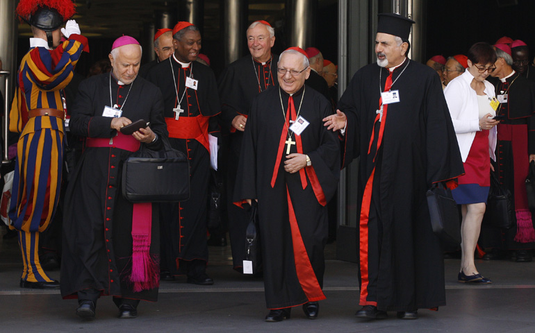 Archbishop Louis Sako of Baghdad, Iraq, patriarch of the Chaldean Catholic Church, center, and other prelates leave the opening session of the extraordinary Synod of Bishops on the family Monday at the Vatican. (CNS/Paul Haring) 