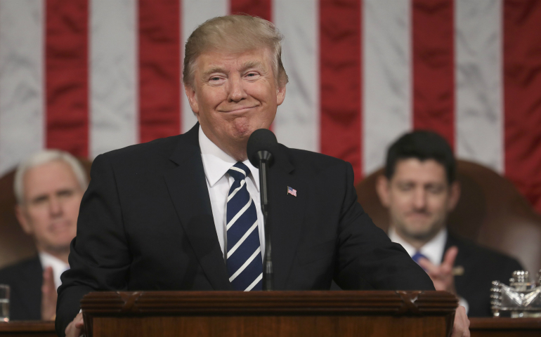 President Donald Trump is applauded by Vice President Mike Pence and U.S. House Speaker Paul Ryan, R-Wis., while delivering his first address to a joint session of Congress Feb. 28 in Washington. (CNS photo/Jim Lo Scalzo pool via Reuters)