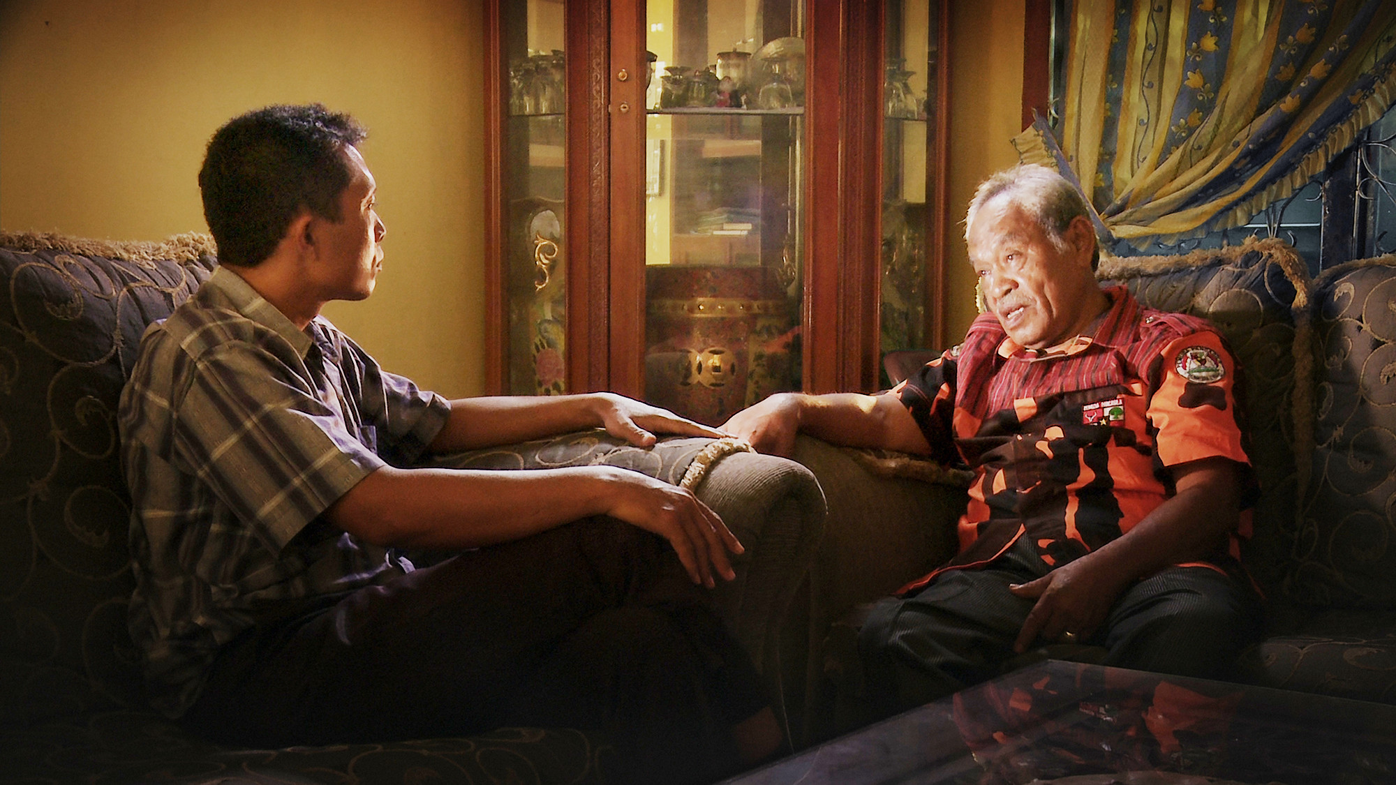 Adi questions Commander Amir Siahaan, one of the death squad leaders responsible for his brother’s death during the Indonesian genocide, in Joshua Oppenheimer’s documentary "The Look of Silence." (Courtesy of Drafthouse Films and Participant Media)