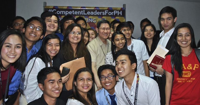 Cardinal Tagle (center) told these youth leaders at the March 1 Competent Leaders for PH (Philippines) summit at University of Asia and the Pacific, “It’s important you hone all your skills, but your most important resource today and in the future is your faith.” (N.J. Viehland)