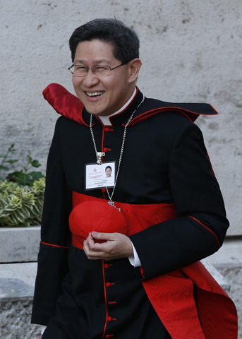 Cardinal Luis Antonio Tagle of Manila, Philippines, arrives Monday for the opening session of the extraordinary Synod of Bishops on the family at the Vatican. (CNS/Paul Haring) 