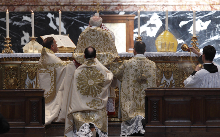 Cardinal Walter Brandmuller elevates the Eucharist during a May 2011 Tridentine-rite Mass at the Altar of the Chair in St. Peter's Basilica at the Vatican. (CNS/Paul Haring) 