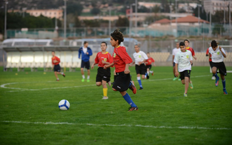 More than 200 young Arab, Druze and Jewish children from communities across northern Israel played in a Dec. 15 soccer tournament to commemorate 100 years since the Christmas Truce. (Courtesy of the British Embassy/Ben Kelmer)