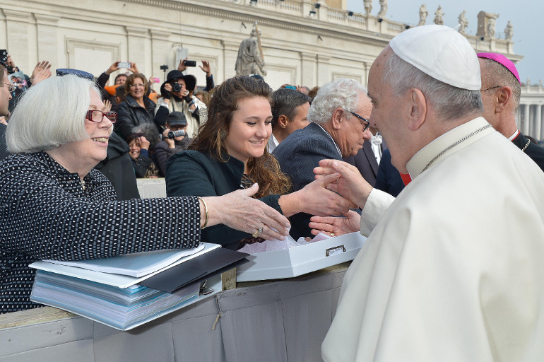 Saint Mary's College president Carol Mooney, left, and student Kristen Millar, center, greet Pope Francis at the general audience Nov. 26. (Courtesy of L’Osservatore Romano)