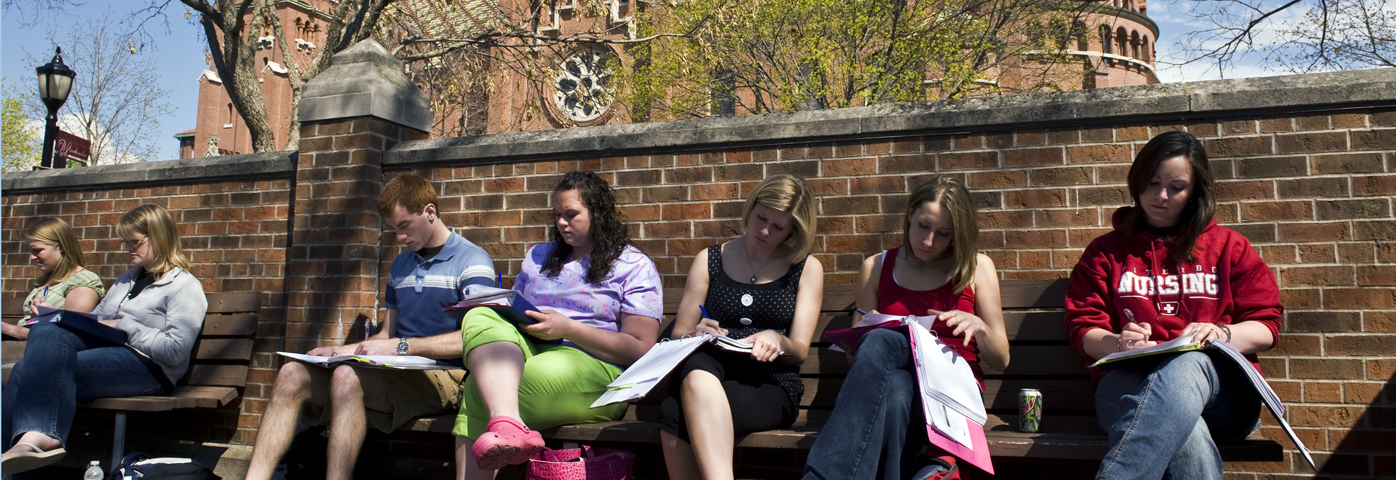 Viterbo University students enjoy class outside on a spring day. (Steve Woit)