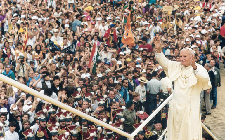 Pope John Paul II greets the World Youth Day crowd in Czestochowa, Poland, in 1992. An estimated 1.5 million people from 80 countries attended the third international World Youth Day. (CNS file photo) 