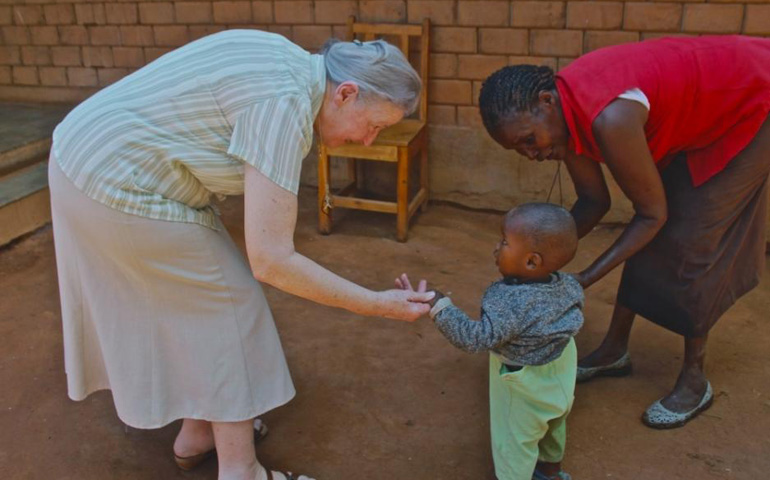 Sr. Mary Owens greets one of the latest arrivals to Nyumbani Village, a planned community outside of Nairobi, Kenya, which she helped develop to care for people affected by HIV/AIDS and their surviving relatives. (Jo Piazza)