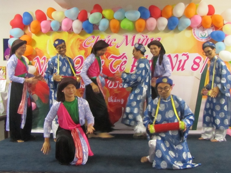 Brothers of Clergy of God’s House in costumes perform a dance at St. Nguyen Duy Khang Church on International Women's Day. (Teresa Hoang Yen)