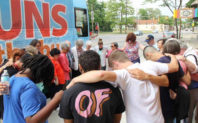 Nuns on the Bus holds a moment of solidarity and prayer with the "Homies" of the Farm Labor Organizing Committee in Toledo, Ohio. (Jennifer Wong/Courtesy of NETWORK)