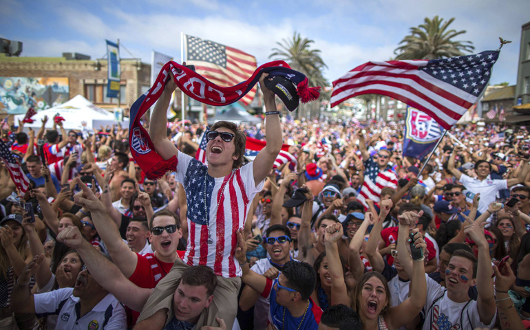 Fans cheer at a viewing party in Hermosa Beach, Calif., June 16, after the U.S. scored a second goal during the 2014 Brazil World Cup soccer match against Ghana. (CNS/Reuters/Lucy Nicholson)