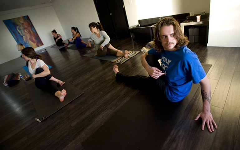 Cole Jacobs, who recently turned 20, is among one of the youngest yoga instructors in California. He teaches a Vinyasa yoga class. (RNS/Orange County Register/H. Lorren Au Jr.)