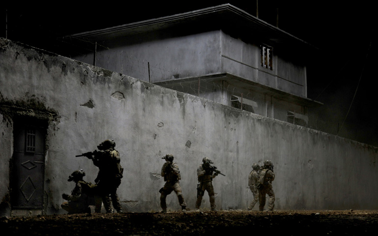 U.S. Navy SEALs are portrayed in a scene from the movie "Zero Dark Thirty." (CNS/Sony) 