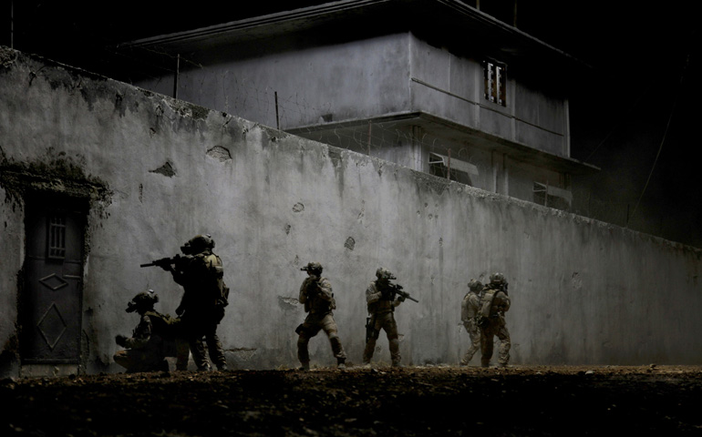 U.S. Navy SEALs are portrayed in a scene from the movie "Zero Dark Thirty." (CNS/Sony)