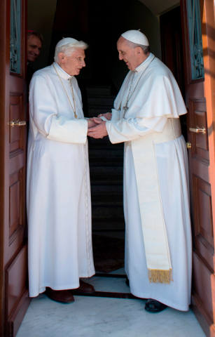 Retired Pope Benedict XVI greets Pope Francis at the Vatican May 2.(CNS/L'Ossevatore Romano via Reuters)