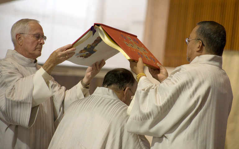 The Book of Gospels is held over Auxiliary Bishop Robert W. McElroy during his ordination Mass at St. Mary's Cathedral in San Francisco in 2010. Pope Francis said bishops should “charm [the world] with the beauty of love [and] seduce it with the freedom bestowed by the Gospel." 