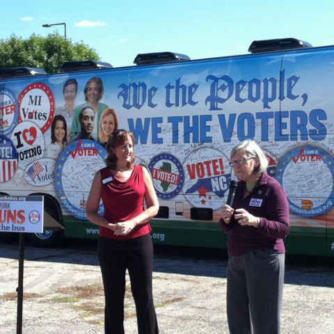 Social Service Sr. Simone Campbell, executive director of NETWORK, right, talks to people about the importance of voting during rally in Mankato, Minn., last September during the 2014 Nuns on the Bus tour. (Courtesy of NETWORK)