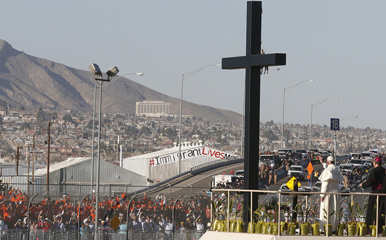 Pope Francis prays at a cross on the border with El Paso, Texas, before celebrating Mass at the fairgrounds in Ciudad Juarez, Mexico, Feb. 17. (CNS/Paul Haring)