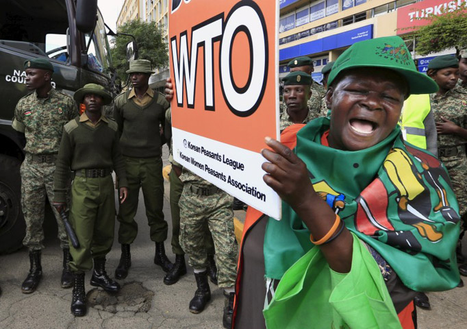 A women protests against the World Trade Organization in Nairobi, Kenya’s capital, on Dec. 17, 2015. (Noor Khamis/Reuters)