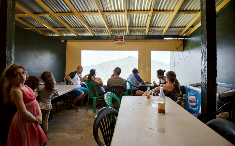 People gather at a rural establishment in Puerto Rico's El Yunque region in March 2016. (Dreamstime/Mihaiocoman)