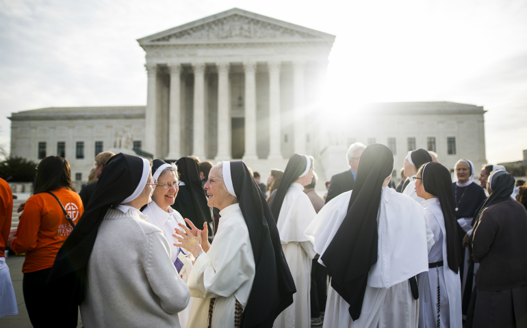 Women religious gather outside the U.S. Supreme Court in Washington March 23, the day the high court heard oral arguments in religious groups' suit against the Affordable Care Act's contraceptive mandate. (CNS photo/Jim Lo Scalzo, EPA)