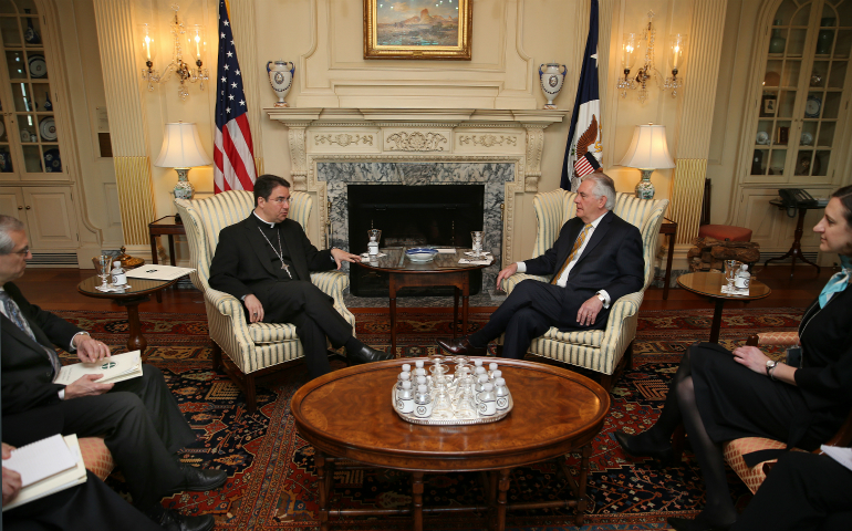 Bishop Oscar Cantu of Las Cruces, N.M., gestures during a March 23 meeting with U.S. Secretary of State Rex Tillerson at the State Department in Washington. Partially obscured at left is Stephen Colecchi, director of the Office of International Justice and Peace at the U.S. Conference of Catholic Bishops. (CNS photo/Bob Roller)