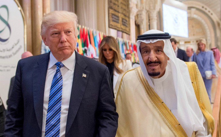 U.S. President Donald Trump walks with Saudi King Salman during the opening session of the Gulf Cooperation Council summit May 21 in Riyadh, Saudi Arabia. (CNS photo/Saudi Press Agency via EPA)