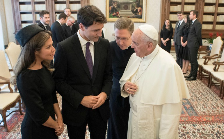 Pope Francis exchanges gifts with Canada's Prime Minister Justin Trudeau and his wife Sophie Gregoire Trudeau during a private audience at the Vatican May 29. (CNS photo/L'Osservatore Romano via Reuters)