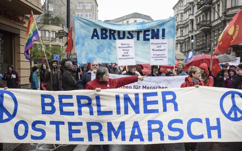 A group marching for nuclear disarmament carries a banner during a protest in mid-April in Berlin. (CNS photo/Clemens Bilan, EPA)
