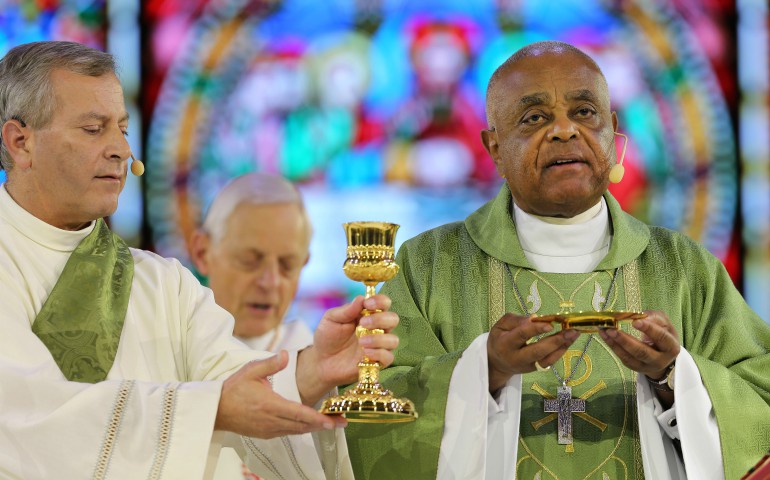 Atlanta Archbishop Wilton D. Gregory, right, Concelebrates Mass during the "Convocation of Catholic Leaders: The Joy of the Gospel in America" July 2 in Orlando, Fla. (CNS photo/Bob Roller)