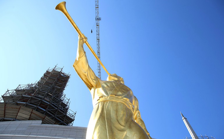 A gold-leaf statue depicting the ancient Mormon prophet, Moroni, is prepared for placement on one of the spires of the new Mormon temple in Rome on March 25, 2017. (Claudio Falanga/Intellectual Reserve Inc.)