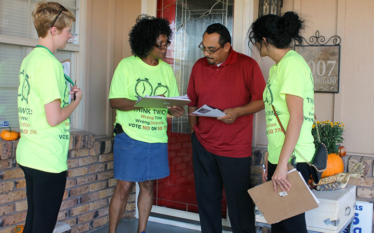 Connie Johnson, center, chairwoman of the Oklahoma Coalition to Abolish the Death Penalty, campaigns against the death penalty in an Oklahoma City neighborhood on Oct. 16, 2016. (RNS/Bobby Ross Jr.)