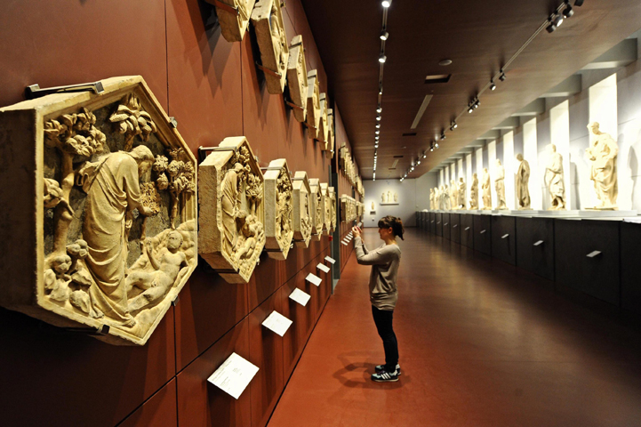 A visitor takes a photo in the gallery of the bell tower in the redesigned Museo dell'Opera de Duomo in Florence, Italy, on Oct. 21.