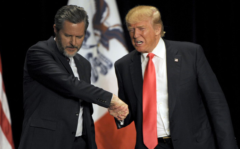 Donald Trump, right, shakes hands with Jerry Falwell Jr. during a campaign event at the Orpheum Theatre in Sioux City, Iowa, on Jan. 31, 2016. (Photo courtesy of Reuters/Dave Kaup)