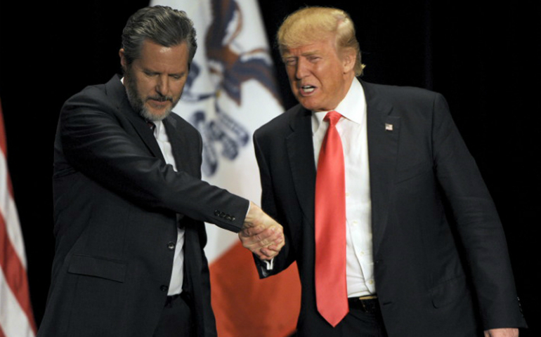 Republican presidential candidate Donald Trump, right, shakes hands with co-headliner Jerry Falwell Jr., leader of Liberty University, during a campaign event at the Orpheum Theatre in Sioux City, Iowa, on Jan. 31, 2016. Photo courtesy of Reuters/Dave Kaup