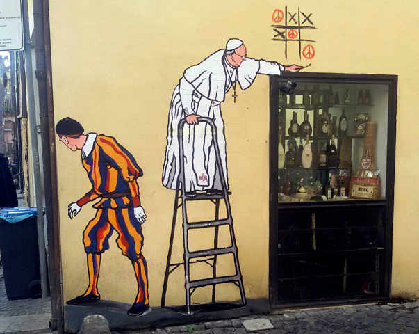 A graffiti depicting Pope Francis and a Swiss guard is seen in Borgo Pio, in Rome Oct. 19. (Reuters/stringer)