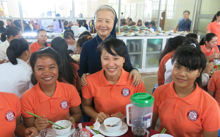 Sr. Pascale Le Thi Triu, a Daughters of Charity of St. Vincent de Paul nun, celebrates in May with housemaids at the 10th anniversary of job training courses offered by the sisters to disadvantaged women in remote areas of Vietnam. (GSR photo/Joachim Pham)
