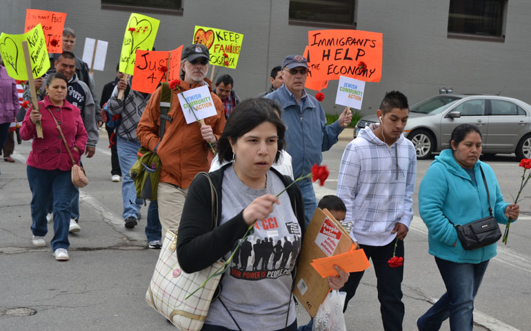 Hundreds of people participate in a Walk for Justice and interfaith prayer service May 10 in Cedar Rapids, Iowa. The participants were commemorating the fifth anniversary of the raid on the Agriprocessors Plant in Postville. (CNS/Dan Russo)