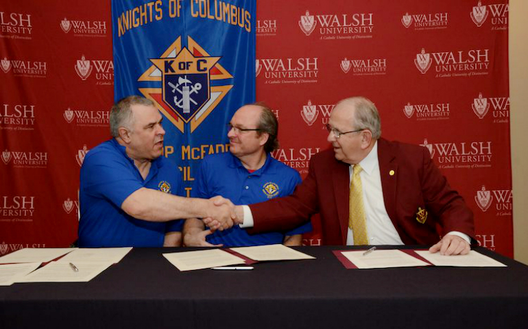 Jeff Weber and David Wechter of the Knights of Columbus, Bishop McFadden Council No. 3777, with Richard Jusseaume, president of Walsh University in North Canton, Ohio (Courtesy of Walsh University)