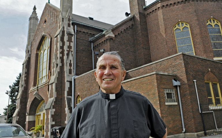 Fr. Dan Mallette in front of St. Margaret of Scotland Parish in Chicago in 2012 (Chicago Sun-Times/John H. White)