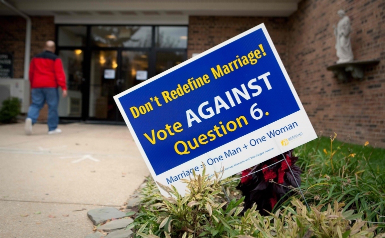 A sign asking voters to reject same-sex marriage is seen near the entrance to St. Joseph Church in Largo, Md., Nov. 3. Initiatives concerning same-sex marriage, which is opposed by the Catholic Church, are on the ballot in Maryland, Minnesota Washington and Maine. The archbishops of Washington and Baltimore have called on Catholics and supporters of traditional marriage to vote to overturn the new Maryland law legalizing gay marriage. (CNS photo/Nancy Phelan Wiechec) (Nov. 3, 2012)